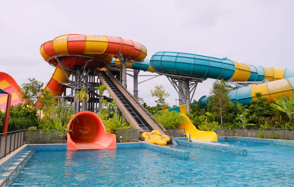 Bright water slides at a tropical water park.
