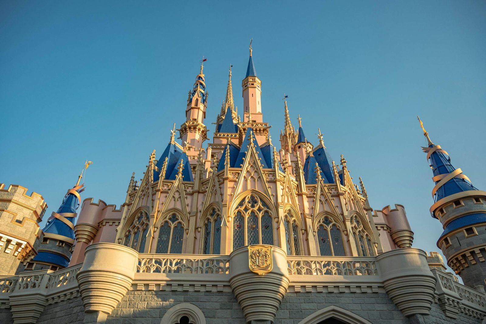 A majestic castle glowing in warm sunset colors.