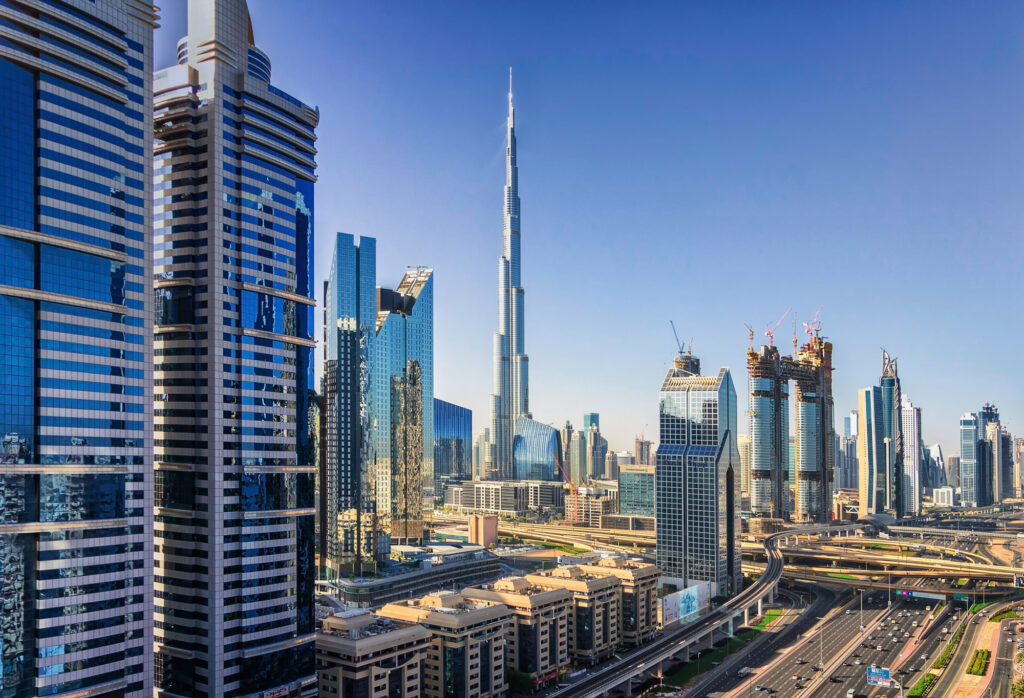Dubai city skyline with Burj Khalifa and modern skyscrapers in daylight.