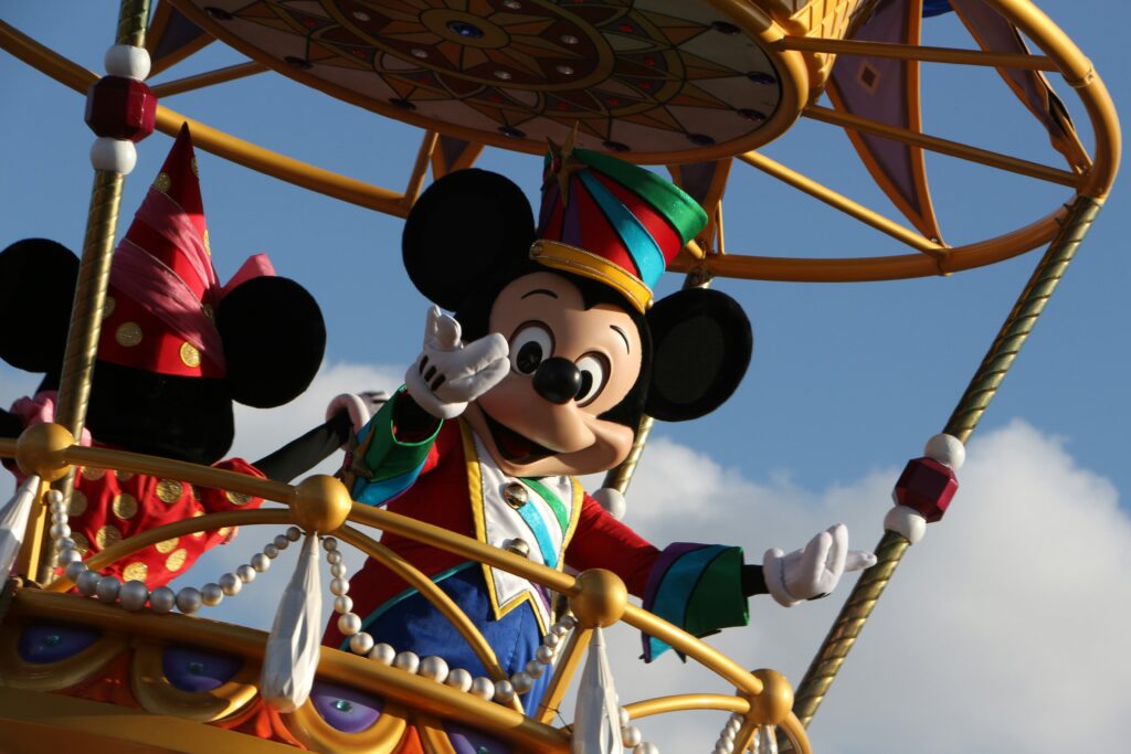 Mickey Mouse waving from a decorative hot air balloon ride.